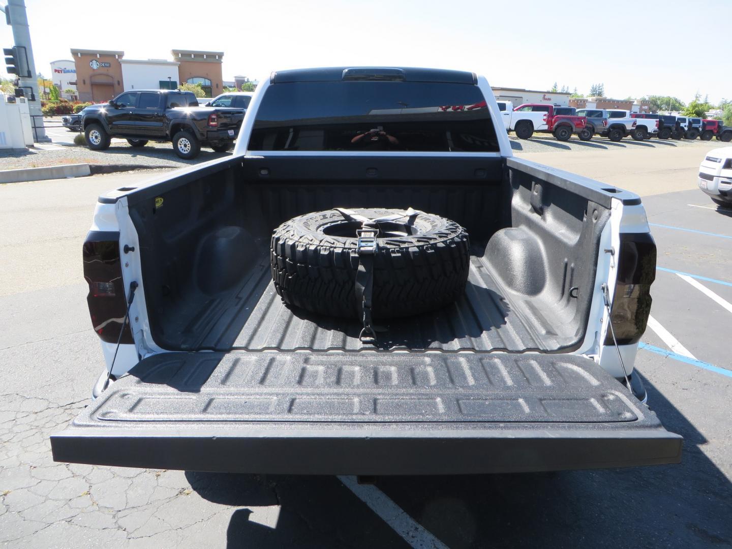 2018 White /BLACK Chevrolet Silverado 1500 LT (3GCPCREC7JG) with an 5.3L V8 OHV 16V engine, automatic transmission, located at 2630 Grass Valley Highway, Auburn, CA, 95603, (530) 508-5100, 38.937893, -121.095482 - Must see Pre Runner.... CST front lift spindals, Camburg UCA's, King Adjustable 2.5 Coil-overs, King 2.5 rear shocks, 35" Toyo RT Trail tires, 17" Method Race wheels, MZ front skid plate, G2 rear differntail cover, Full size bed mounted spare tire, Black Vinyl roof wrap, smoke tail lights and 3rd br - Photo#14